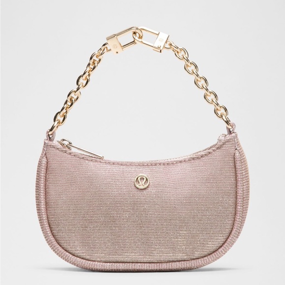 lululemon athletica Handbags - Lululemon Athletica Shimmering Pink Wristlet
